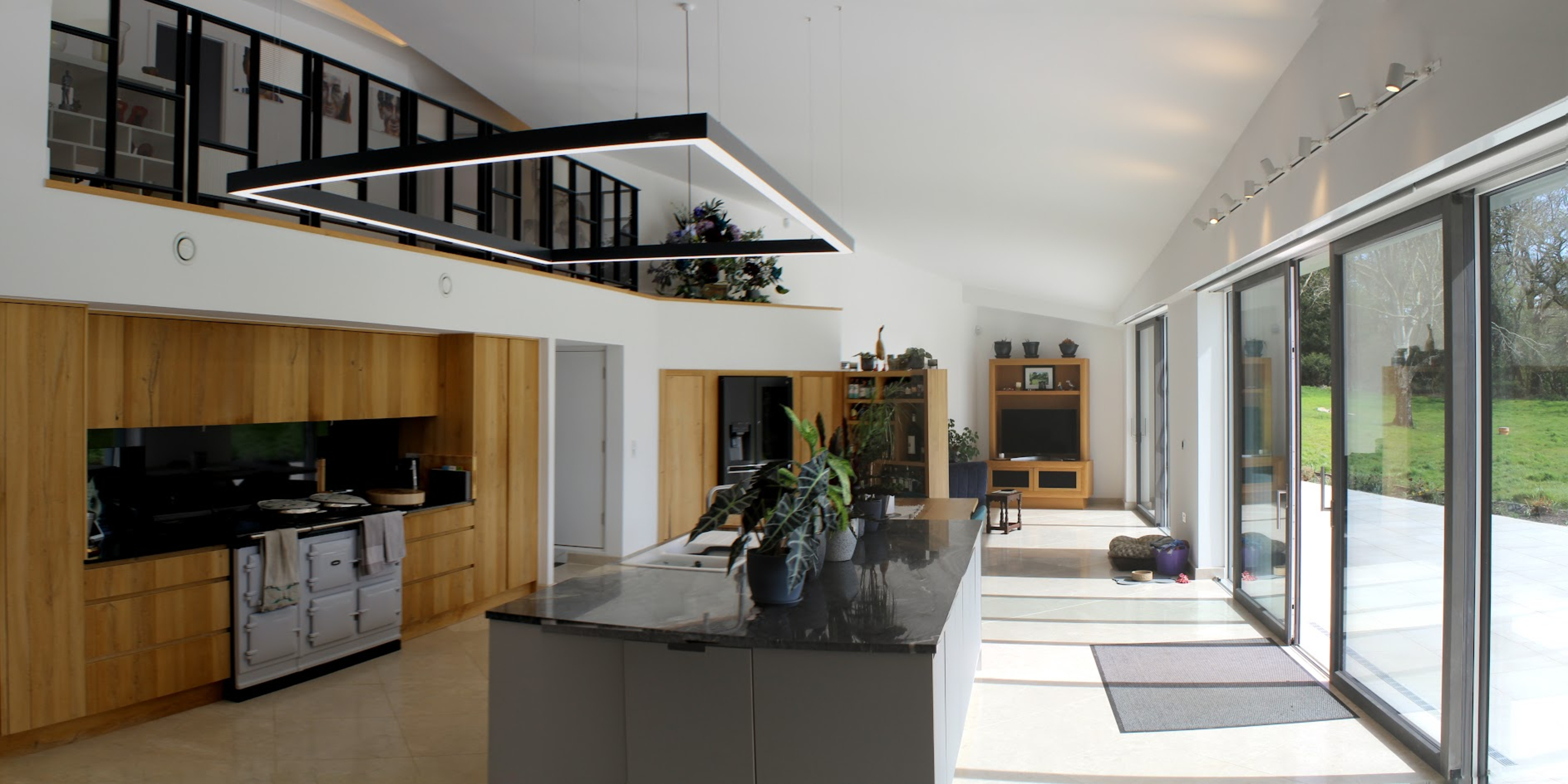 Large-format tiled floor in a light contemporary kitchen